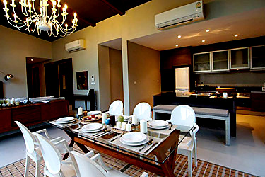 Living, Dining  and Kitchen Area with Garden and Pool View